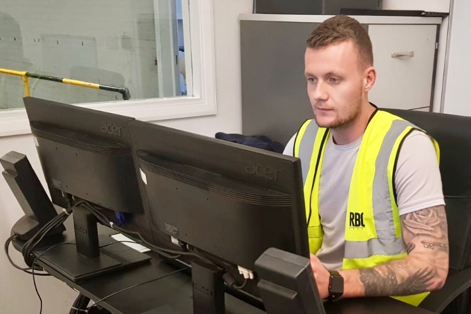 Tyler Smith working at his production office desk